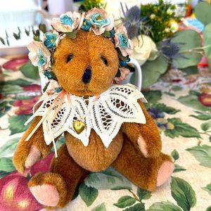 Stuff bear, all dressed up with floral crown, laced shawl, heart pendant